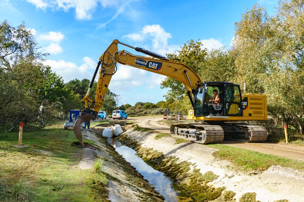 Een graafmachine bij de AWD